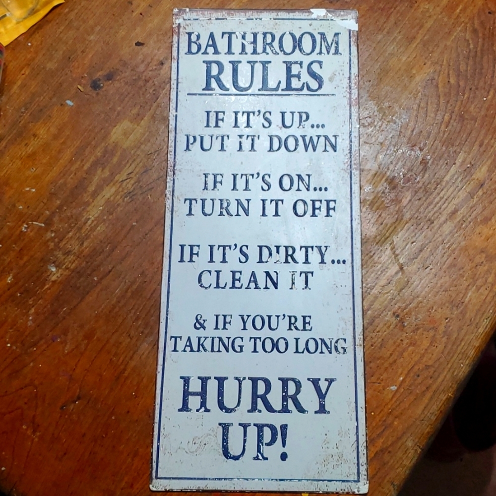 Bathroom sign distressed